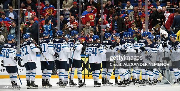 Finland's players celebrate after winning the semifinal game Finland vs Russia at the 2016 IIHF Ice Hockey World Championship in Moscow on May 21,...