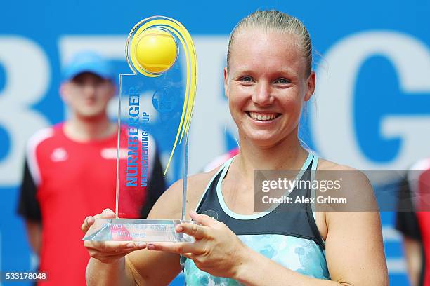 Kiki Bertens of Netherlands poses with the trophy after winning her singles final match against Mariana Duque-Marino of Colombia on day eight of the...