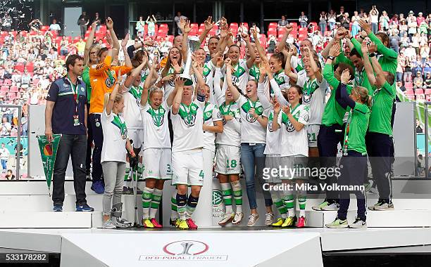 Nilla Fischer of Wolfsburg and team celebrate the winning of the cup after the women's cup final between SC Sand and VFL Wolfsburg at...