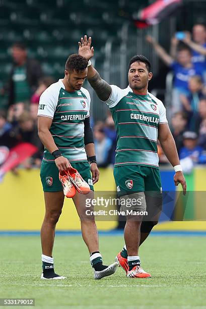 Manu Tuilagi of Leicester Tigers limps around the pitch after hurting his hamstring with team mate Peter Betham after the Aviva Premiership semi...
