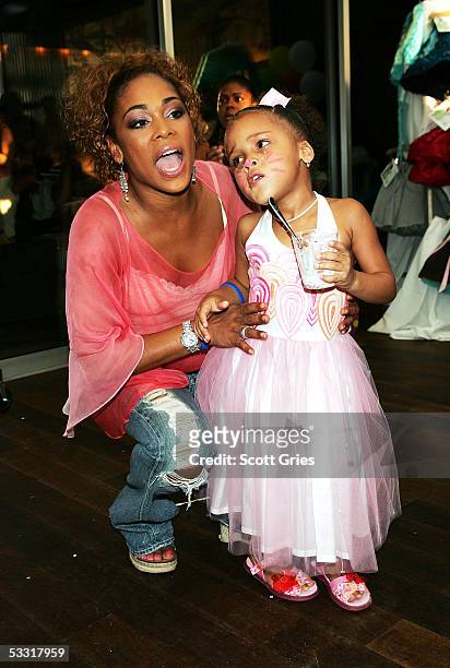 Tionne "T Boz" Watkins of TLC and her daughter Chase Rolison pose for a photo during a fashion show and party to benefit the Make A Wish Foundation...