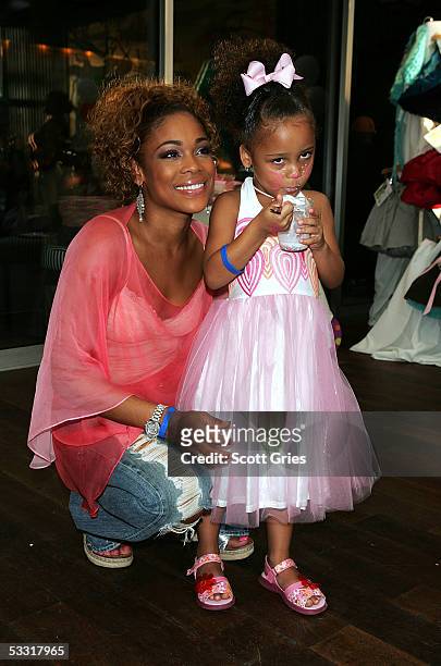 Tionne "T Boz" Watkins of TLC and her daughter Chase Rolison pose for a photo during a fashion show and party to benefit the Make A Wish Foundation...