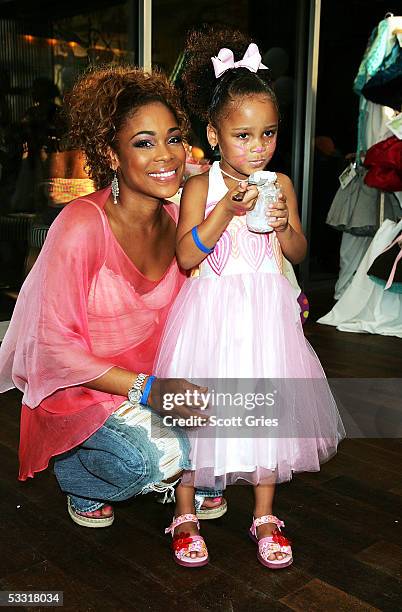 Tionne "T Boz" Watkins of TLC and her daughter Chase Rolison pose for a photo during a fashion show and party to benefit the Make A Wish Foundation...