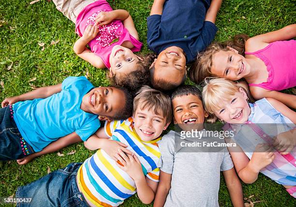 kids outside - group of kids stock pictures, royalty-free photos & images
