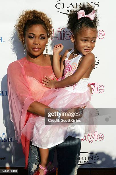 Tionne "T Boz" Watkins of TLC and her daughter Chase Rolison arrive at a fashion show and party to benefit the Make A Wish Foundation at The Park...