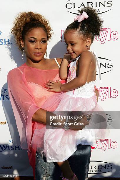 Tionne "T Boz" Watkins of TLC and her daughter Chase Rolison arrive at a fashion show and party to benefit the Make A Wish Foundation at The Park...