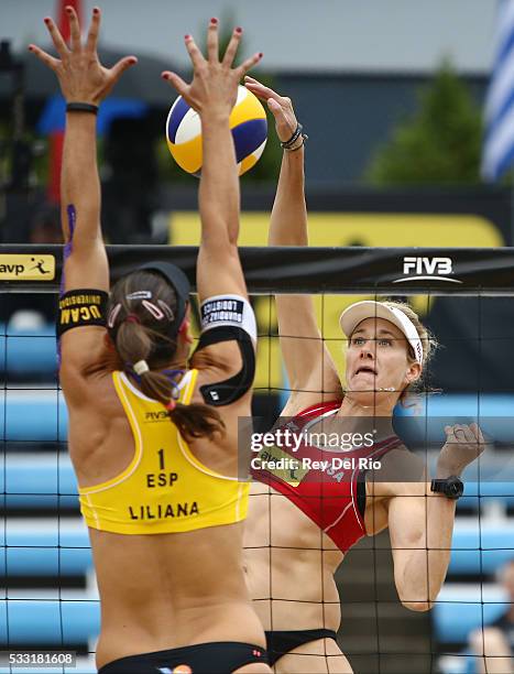 Kerri Walsh Jennings of the USA hits the ball over the net defended by Liliana Fernandez of Spain during day 5 of the 2016 AVP Cincinnati Open on May...