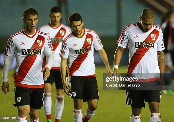 Jonathan Maidana of River Plate and his teammates leave the field at the end of the first half during a match between Arsenal FC and River Plate as...