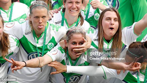 Lara Dieckenmann of Wolfsburg and Anna Blaesse of Wolfsburg celebrate the winning of the trophy after the women's cup final between SC Sand and VFL...