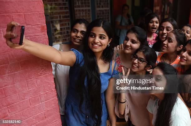 Girl students in jubilant mood after their Class XII board examination result declared, at St. Thomas School, on May 21, 2016 in New Delhi, India. A...