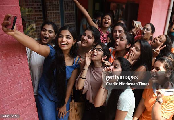 Girl students in jubilant mood after their Class XII board examination result declared, at St. Thomas School, on May 21, 2016 in New Delhi, India. A...