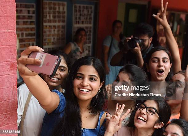 Girl students in jubilant mood after their Class XII board examination result declared, at St. Thomas School, on May 21, 2016 in New Delhi, India. A...