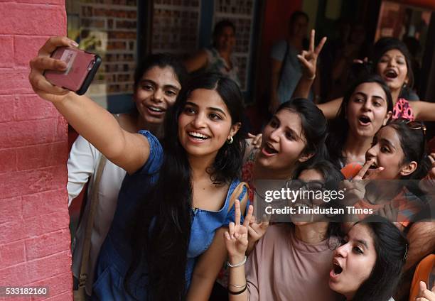 Girl students in jubilant mood after their Class XII board examination result declared, at St. Thomas School, on May 21, 2016 in New Delhi, India. A...