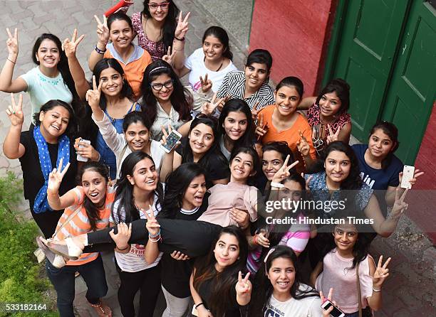 Girl students in jubilant mood after their Class XII board examination result declared, at St. Thomas School, on May 21, 2016 in New Delhi, India. A...