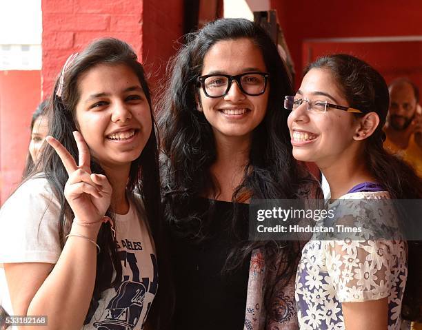 Girl students of St. Thomas School, in joyful mood as they hug each other after passing class XII CBSE Board Exams, results announced today by the...