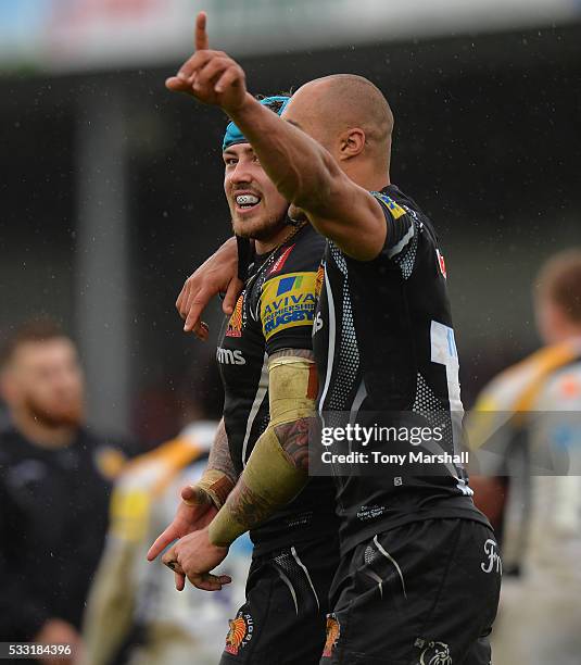 Jack Nowell and Olly Woodburn of Exeter Chiefs celebrate at the end of the match during the Aviva Premiership semi final match between Exeter Chiefs...