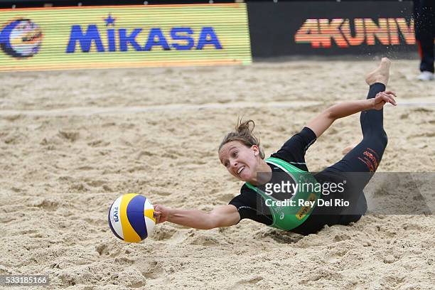 Sophie van Gestel of the Netherlands dives for the ball during her match against Chen Xue and Xinyi Xia of China during day 5 of the 2016 AVP...