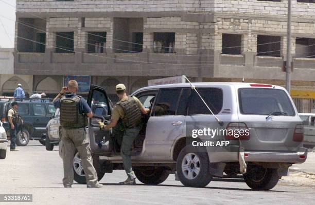 Security, guard the streets leading to the general hospital in the southern city of Basra, 500 kms from Baghdad, where the body of killed US...