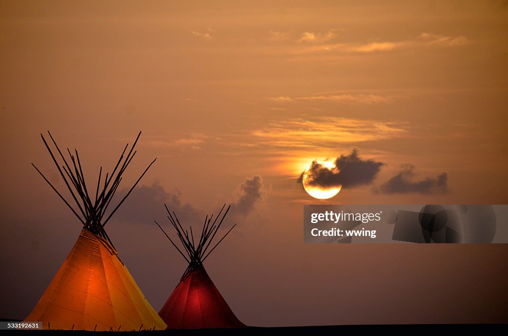 Two Teepees at Sunset