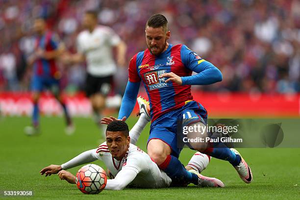 Chris Smalling of Manchester United and Connor Wickham of Crystal Palace battle for the ball during The Emirates FA Cup Final match between...