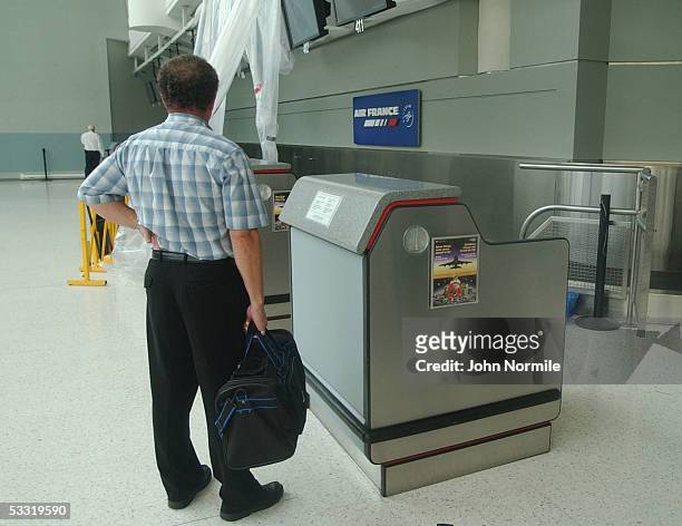 Michel Zaloum looks for information on flights at the closed Air France counter at Pearson International Airport a day after the crash of Air France...