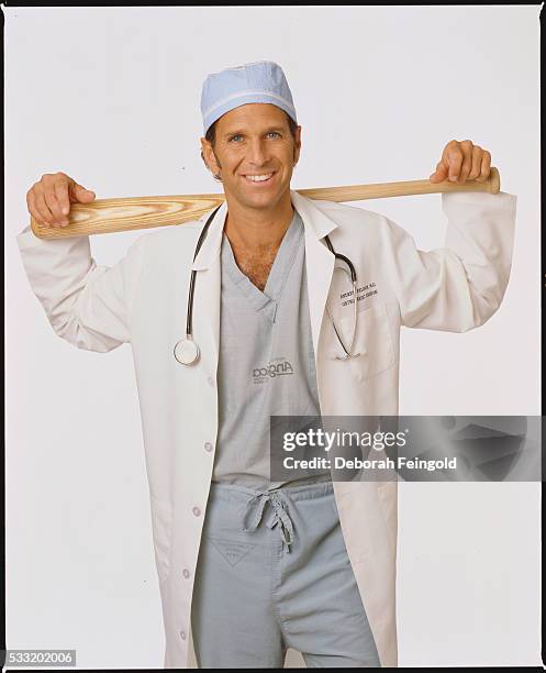 Deborah Feingold/Corbis via Getty Images) Sports Physician Andrew Feldman Holding Baseball Bat