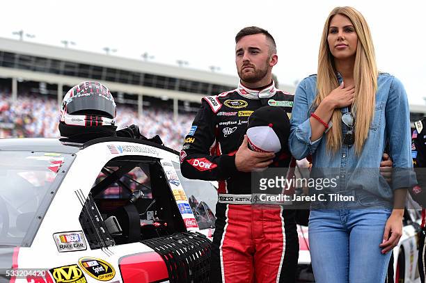 Austin Dillon, driver of the DOW Chevrolet, stands on the grid with his girlfriend, Whitney Ward, prior to the NASCAR Sprint Cup Series Sprint...