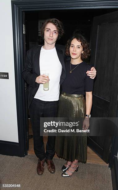 Tomo Campbell and Jessica Brown Findlay attend a private view of artist Tomo Campbell's new exhibition 'Held On The Tips Of Fingers" at Golborne...