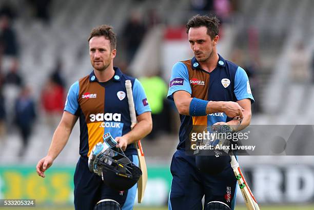 Hamish Rutherford and Neil Broom of Derbyshire leave the pitch after their victory in the NatWest T20 Blast between Lancashire and Derbyshire at Old...