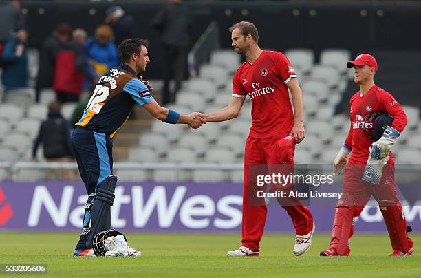 Hamish Rutherford of Derbyshire shakes hands with Tom Smith of Lancashire after the NatWest T20 Blast between Lancashire and Derbyshire at Old...