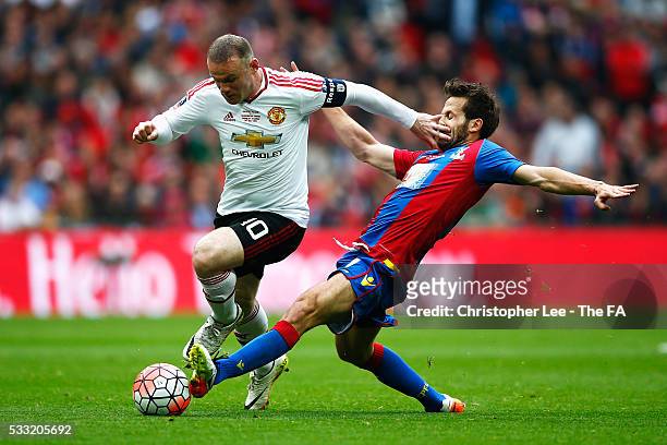 Wayne Rooney of Manchester United and Yohan Cabaye of Crystal Palace compete for the ball during The Emirates FA Cup Final match between Manchester...