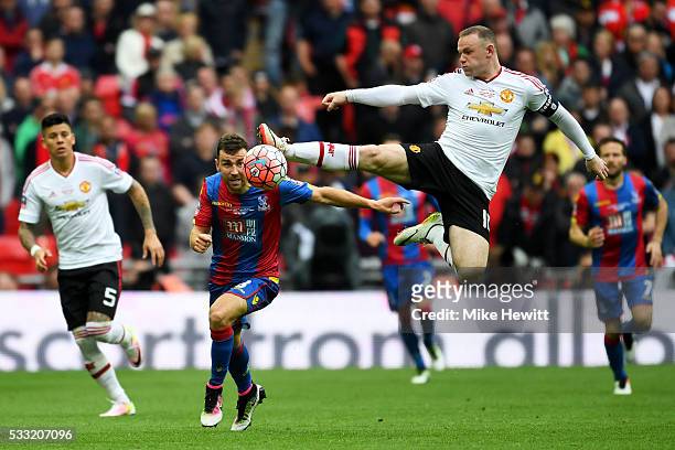 Wayne Rooney of Manchester United jumps for the ball ahead of James McArthur of Crystal Palace during The Emirates FA Cup Final match between...