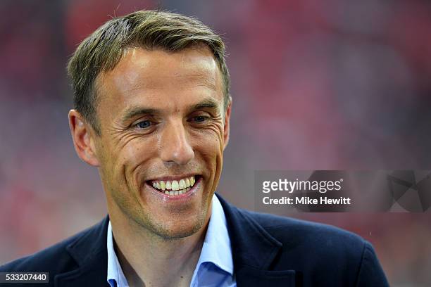 Pundit Phil Neville smiles prior to The Emirates FA Cup Final match between Manchester United and Crystal Palace at Wembley Stadium on May 21, 2016...