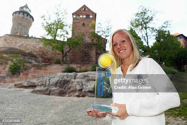 Kiki Bertens of Netherlands poses in front of the castle after winning the Nuernberger Versicherungscup 2016 on May 21, 2016 in Nuremberg, Germany.