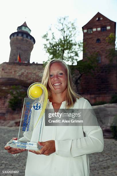 Kiki Bertens of Netherlands poses in front of the castle after winning the Nuernberger Versicherungscup 2016 on May 21, 2016 in Nuremberg, Germany.