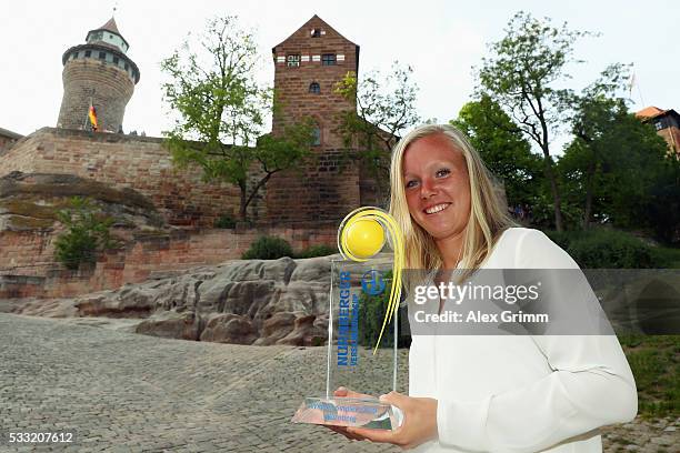 Kiki Bertens of Netherlands poses in front of the castle after winning the Nuernberger Versicherungscup 2016 on May 21, 2016 in Nuremberg, Germany.