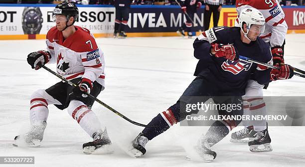 Canada's defender Michael Matheson vies with US forward Brock Nelson during the semifinal game Canada vs USA at the 2016 IIHF Ice Hockey World...