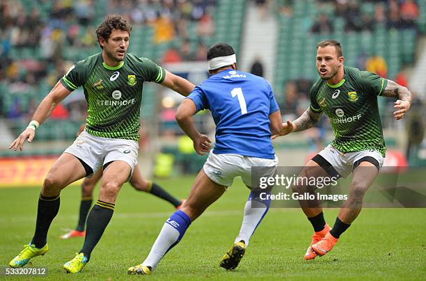 Ryan Kankowski and Francois Hougaard of South Africa stop Alefosio Tapili of Samoa during the match between South Africa and Samoa on day 1 of the...