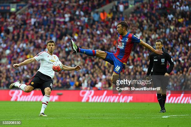 James McArthur of Crystal Palace jumps to block Michael Carrick of Manchester United during The Emirates FA Cup Final match between Manchester United...