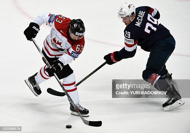 Canada's forward Brad Marchand vies with US defender Jake McCabe during the semifinal game Canada vs USA at the 2016 IIHF Ice Hockey World...
