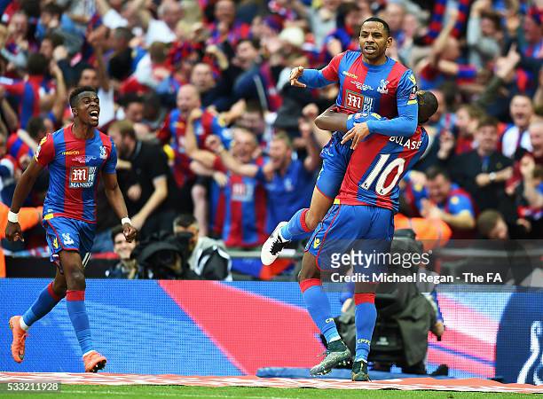 Jason Puncheon of Crystal Palace celebrates scoring his team's first goal with his team mates Yannick Bolasie and Wilfried Zaha during The Emirates...