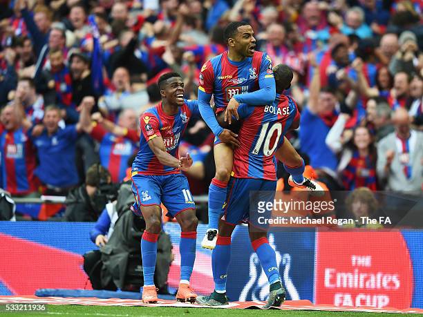 Jason Puncheon of Crystal Palace celebrates scoring his team's first goal with his team mates Yannick Bolasie and Wilfried Zaha during The Emirates...