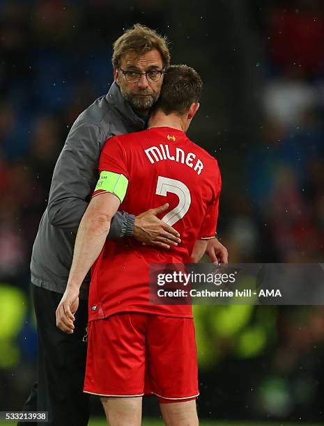 Jurgen Klopp manager of Liverpool hugs James Milner of Liverpool after the UEFA Europa League Final match between Liverpool and Sevilla at St....