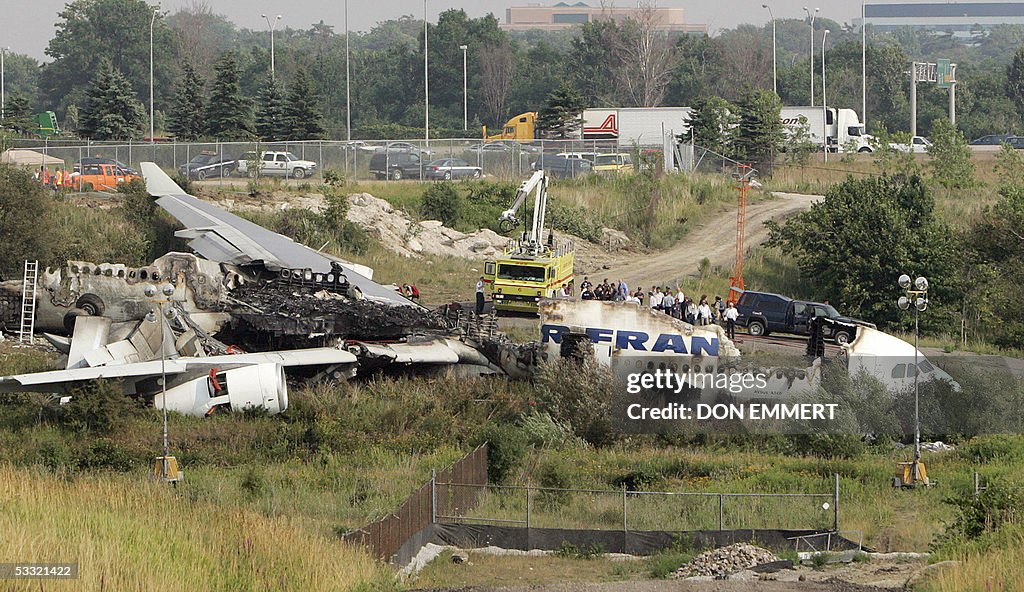 Officials view the wreckage of the Air F