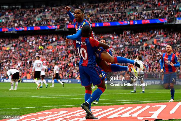 Jason Puncheon of Crystal Palace celebrates with Yannick Bolasie as he scores their first goal during The Emirates FA Cup Final match between...