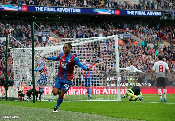 Crystal Palace's English midfielder Jason Puncheon celebrates after scoring the opening goal of the English FA Cup final football match between...