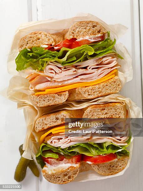 deli style turkey bagel sandwich - baked goods top view stock pictures, royalty-free photos & images