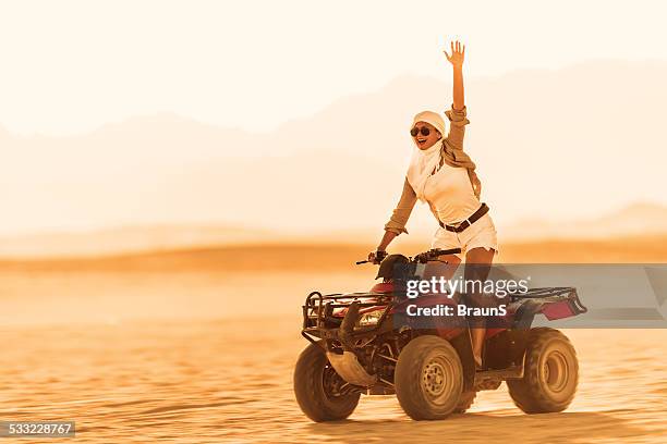 cheerful woman on quad bike. - atv bildbanksfoton och bilder