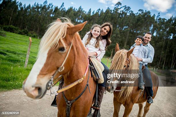 family at the farm - riding horses stock pictures, royalty-free photos & images