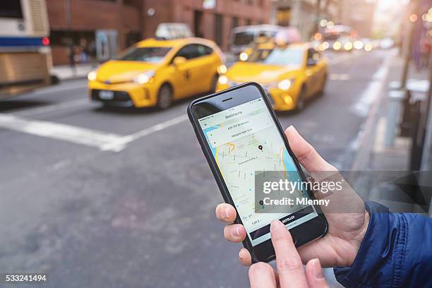 using uber taxi app new york city - uber brand name stock pictures, royalty-free photos & images